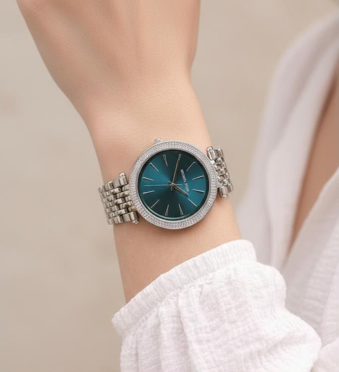 Michael Kors Darci women's silver watch with teal-green dial and crystal bezel