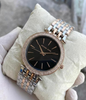 Michael Kors Darci women's two-tone silver and rose gold watch with black dial and crystal bezel